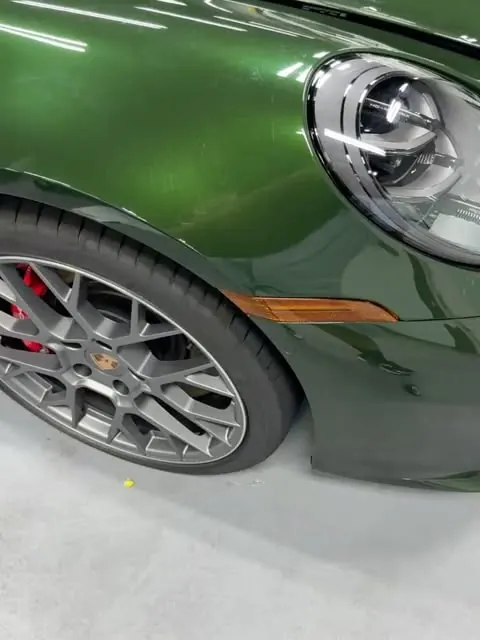 Green car with silver wheel detail