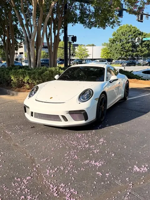White Porsche parked outdoors